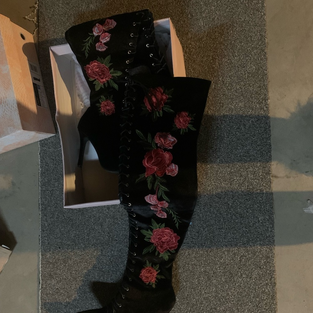 Tall lace up booths with flower detailing 4 1/2 inch heel worn twice